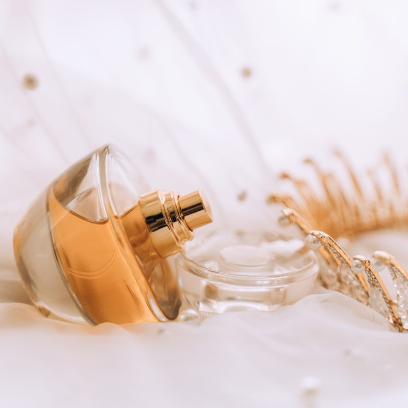 Bridal details on wedding day perfume and crown